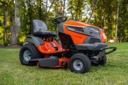 Riding mower being used to mow a new lawn.